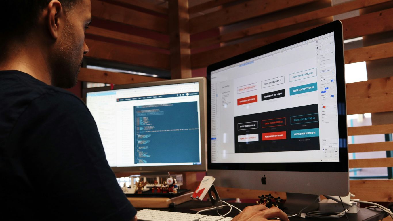 Designer reviewing a website sitemap and page notes